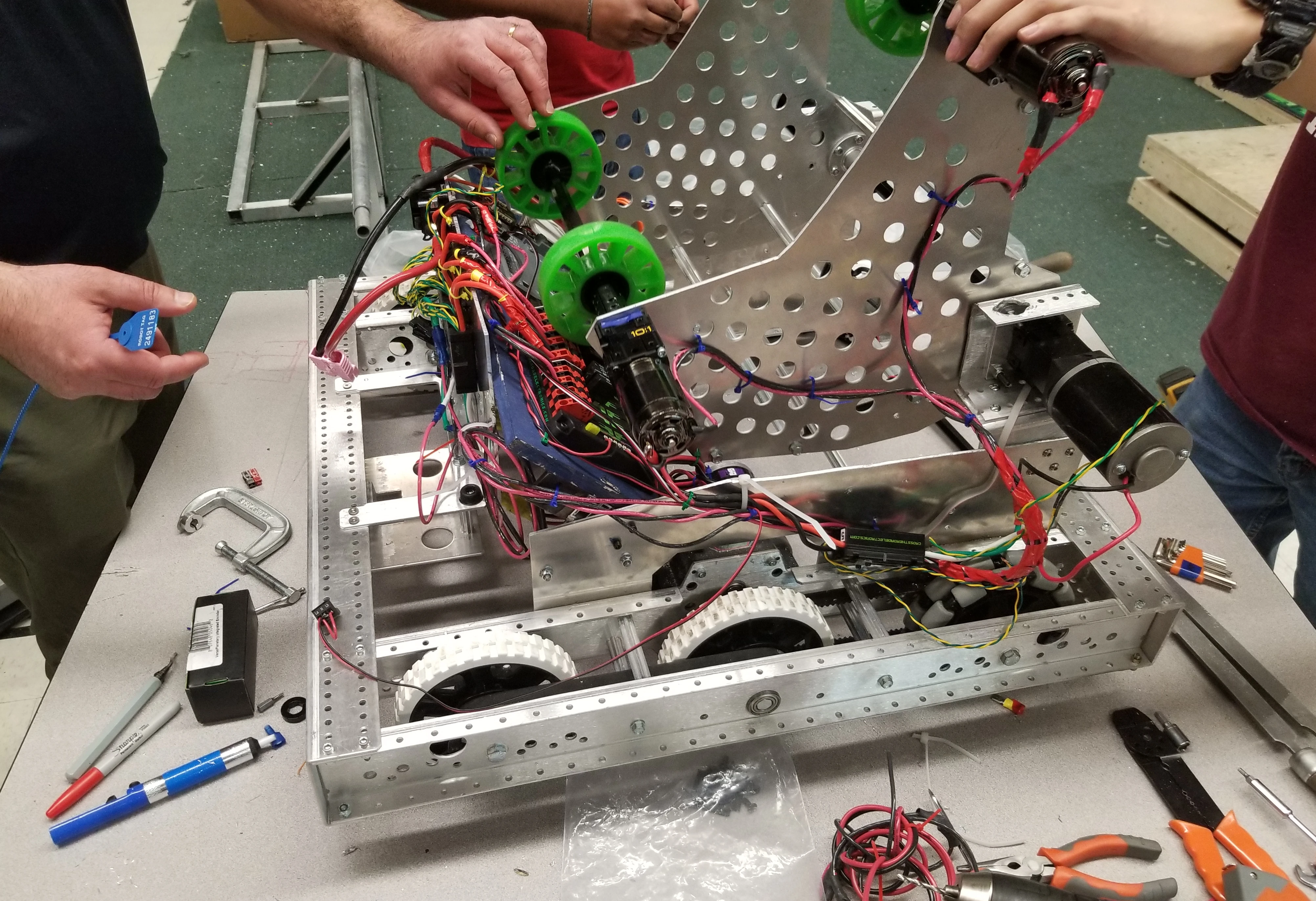 Our 2019 robot, around 28x28 inches, sitting on a workbench.
